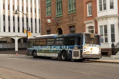 White and blue NJ Transit bus in Trenton, New Jersey.