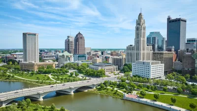 Aerial view of Columbus, Ohio skyline with river in foreground