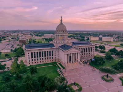 Aerial view of Oklahoma state capitol building at golden hour.