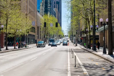 Street view of 4th Avenue, a commercial street of shops and restaurants through the city center of downtown Seattle, Washington.
