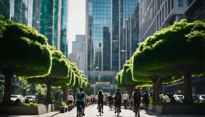 A bustling tree-lined pedestrian bolevard down the middle of a city street, filled with walkers and bikers, protected from lanes of traffic on both sides and surrounded by high-rises.