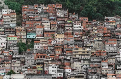 Dense informal settlement on steep hillside in Brazil.