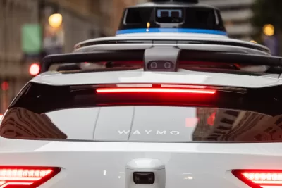 Close-up of back windshield of Waymo autonomous car.