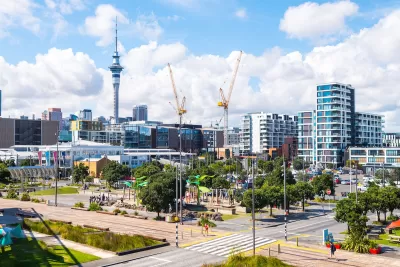 View of Auckland, New Zealand with construction cranes.