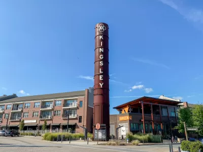 Fort Mill, South Carolina: Kingsley Town Center. Mixed use development of repurposed textile mill with smokestack and streets "Textile Way" and "Broadcloth Street."