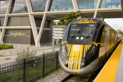 A yellow and black Birghtline high-speed rail train at station in Ft. Lauderdale, Florida.