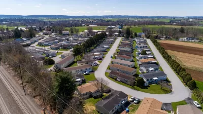 Aerial view of manufactured housing mobile home park in rural area.