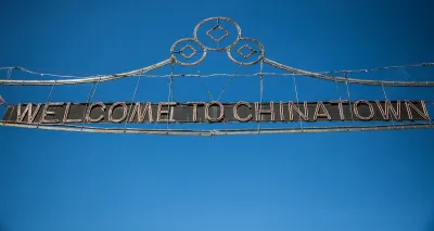 Wire sign over street "Welcome to Chinatown" in New York City.