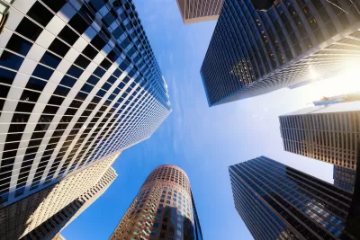 Looking up at cluster of high-rise modern office buildings in San Francisco, California.