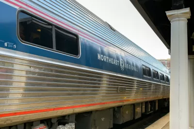 Amtrak train with Northeast Regional painted on the side sitting at a platform