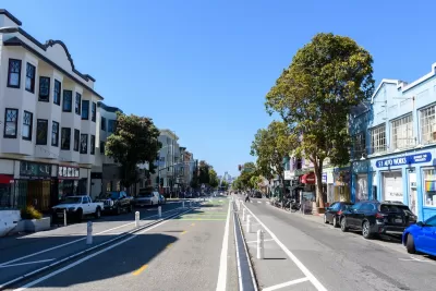 Center-running protected bike lane on Valencia Street in San Francisco, California.