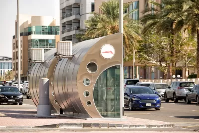 Silver and glass enclosed bus stop in Dubai.