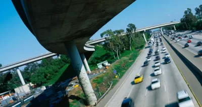 View from under tall freeway overpass in Los Angeles at intersection of I-405 and I-10.