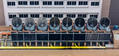 Aerial view of cooling towers on data center roof.