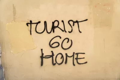 "Tourist go home" graffiti on a wall in Barcelona, Spain.