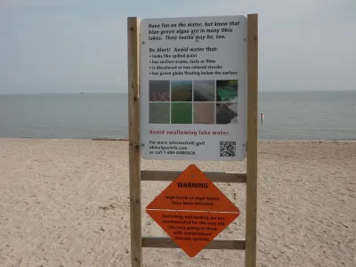 Sign warning of toxic algae bloom at Lake Erie beach in Ohio.