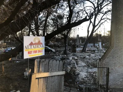"Altadena - Not For Sale" yard sign in front of burned down house after Eaton Fire in Altadena, California in January 2025.