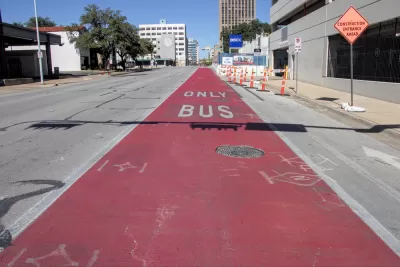 A bright red traffic lane reads “Bus Only.”