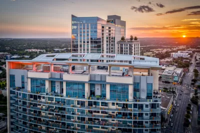 The top floors of a luxury condo building is seen at sunset in Downtown Austin.
