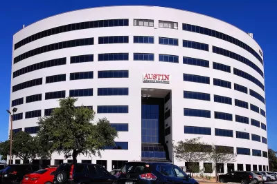 White multistory Austin Independent School District headquearters building in Austin, Texas.