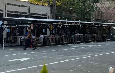 Covered pergolas for outdoor dining line the curb on Ballard Avenue, Seattle