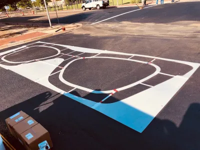 Crosswalk in Lubbock, Texas painted with Buddy Holly style glasses.
