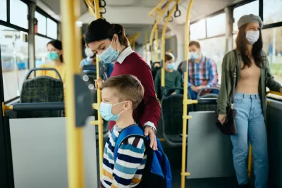 Bus riders wearing masks