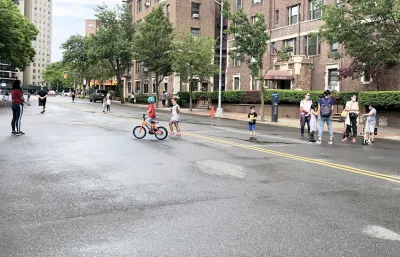 Children and adults biking and hanging out on an Open Street closed to vehicles in New York City during the Covid-19 pandemic.