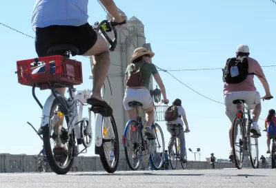 People on bikes riding across 4th Street Bridge in Los Angeles during 2010 CicLAvia event.