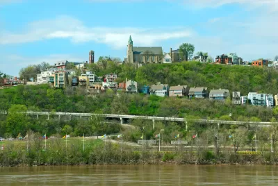Holy Cross Immaculata Church sits atop Mt Adams in Cincinnati, as seen from across the Ohio River in Kentucky.