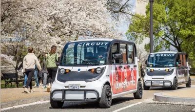 Two Circuit rideshare microbuses in Washington DC.
