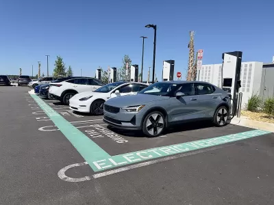 Electric car charging area in a parking lot at a Costco in Clermont, Florida.