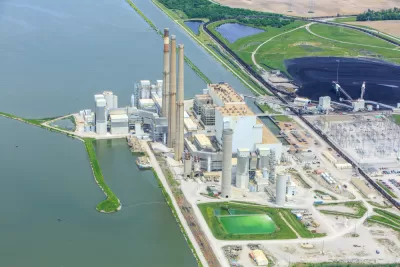 An image of a coal powered energy production facility along an unidentified waterway in Illinois.
