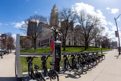 CoGo bike share station with black bikes in front of Columbus City Hall, Ohio