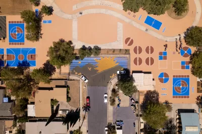 Bird's eye wide view of schoolyard with coated pavement.