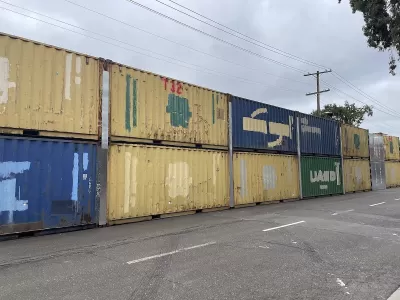 Two-level stack of shipping containers blocking off People's Park in Berkeley, California.