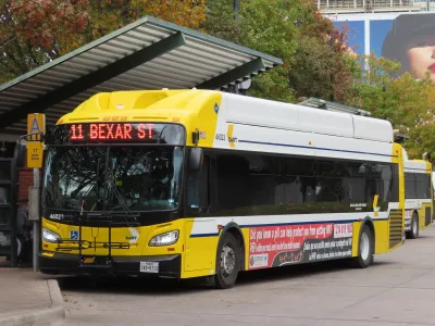 A yellow DART bus