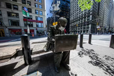 The sculpture of the "Double Check Businessman" in Liberty Park, New York City