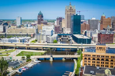 A photo of the downtown skyline in Milwaukee, along the Milwaukee RIver.