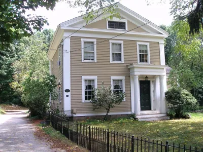Tan historic home in Woodbridge, Connecticut.