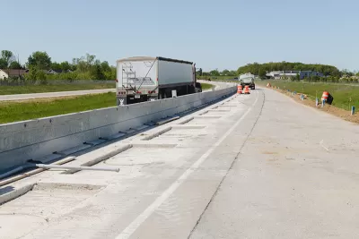 Construction work on highway segment in Indiana that will charge electric vehicles.