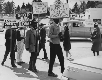 People protesting housing discrimination at rally in 1964.