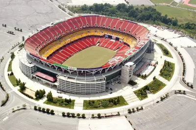 A aerial view of an empty FedEx Field, home of the NFL's Washington Commanders, and parking lot.