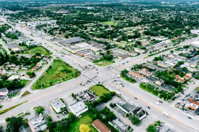 A sprawling view of Miami’s low-density residential areas, bisected by wide surface streets.