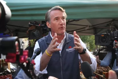 Glenn Youngkin gesturing with his hands while speaking to the media and the public while campaigning for governor of Virginia at the Alexandria Farmers Market.