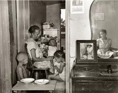 Mrs. Ella Watson, a government charwoman, with three grandchildren and her adopted daughter