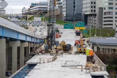Construction work to replace the bridge deck carrying eastbound I-196 over Grand River in downtown Grand Rapids.