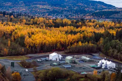 A hub for the NW pipeline, in front of a massive forest with the leaves on the trees turning orange.