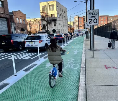 Green bike lane with flexible delineators and textures paint in Hoboken, New Jersey