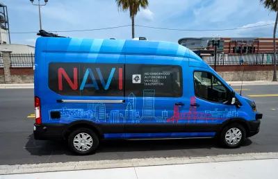 Blue self-driving Ford Transit van shuttle in Jacksonville, Florida.